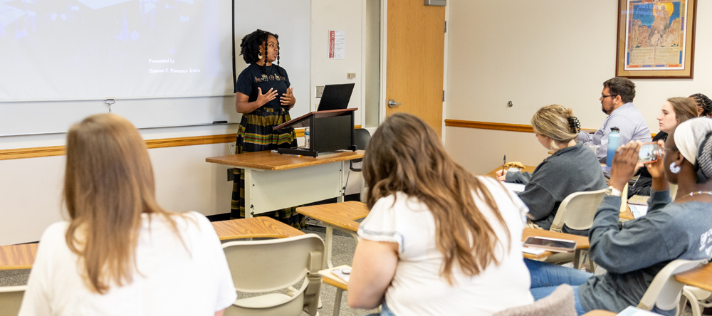 Graduate students learning in a classroom